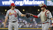 Sep 8, 2025; Seattle, Washington, USA; St. Louis Cardinals starting pitcher Miles Mikolas (39) bumps fists with catcher Jimmy Crooks (8) following the third inning against the Seattle Mariners at T-Mobile Park. Mandatory Credit: Joe Nicholson-Imagn Images