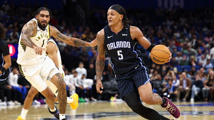 Orlando Magic forward Paolo Banchero drives to the hoop past Indiana Pacers forward Obi Toppin. Orlando Magic forward Paolo Banchero drives to the hoop past Indiana Pacers forward Obi Toppin.