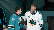 Feb 25, 2023; San Jose, California, USA; San Jose Sharks former player Patrick Marleau talks to former player Joe Thornton during his jersey retirement ceremony before the game against the Chicago Blackhawks at SAP Center at San Jose. Mandatory Credit: Darren Yamashita-Imagn Images