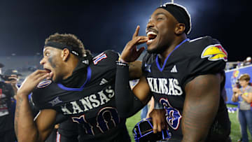 Kansas Jayhawks quarterback Jalon Daniels (6) and Kansas Jayhawks wide receiver Levi Wentz (10) celebrate their win after the game against West Virginia Mountaineers at David Booth Kansas Memorial Stadium on Sept. 20, 2025.