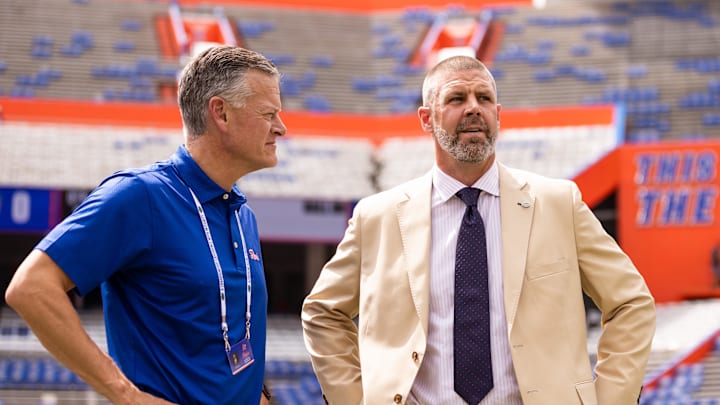 Sep 14, 2024; Gainesville, Florida, USA; Florida Gators athletic director Scott Stricklin (left) and head coach Billy Napier talk before a game against the Texas A&M Aggies at Ben Hill Griffin Stadium. Mandatory Credit: Matt Pendleton-Imagn Images