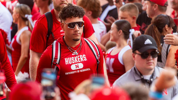 Nebraska Cornhuskers quarterback Dylan Raiola (15) leads the team into the facilities