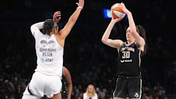 Sep 29, 2024; Brooklyn, New York, USA; New York Liberty forward Breanna Stewart (30) shoots a jump shot over Las Vegas Aces center A'ja Wilson (22) during game one of the 2024 WNBA Semi-finals at Barclays Center. Mandatory Credit: Gregory Fisher-Imagn Images