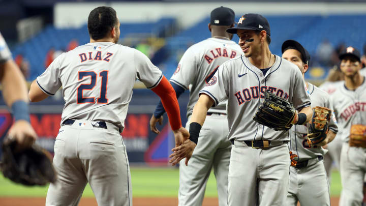 Aug 14, 2024; St. Petersburg, Florida, USA; Houston Astros outfielder Mauricio Dubón (14) and catcher Yainer Diaz (21) celebrate as they beat the Tampa Bay Rays at Tropicana Field.