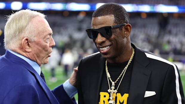 Colorado Buffaloes head coach Deion Sanders (right) talks with Dallas Cowboys owner Jerry Jones before the game against the S
