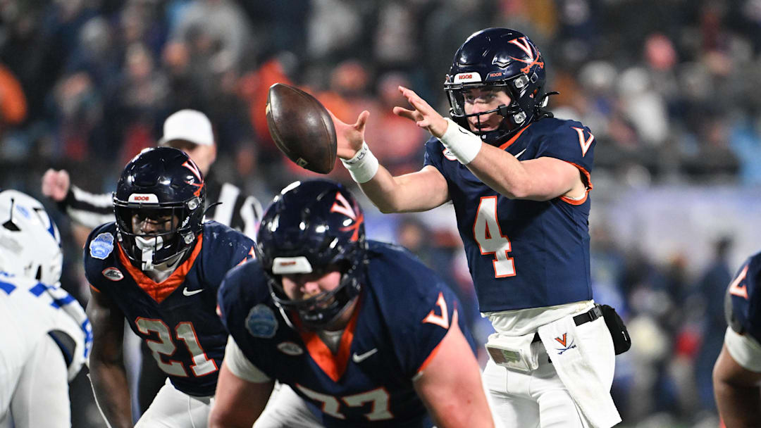 Dec 6, 2025; Charlotte, NC, USA; Virginia Cavaliers quarterback Chandler Morris (4) receives a snap in the third quarter against the Duke Blue Devils during the 2025 ACC Championship game at Bank of America Stadium. Mandatory Credit: Bob Donnan-Imagn Images