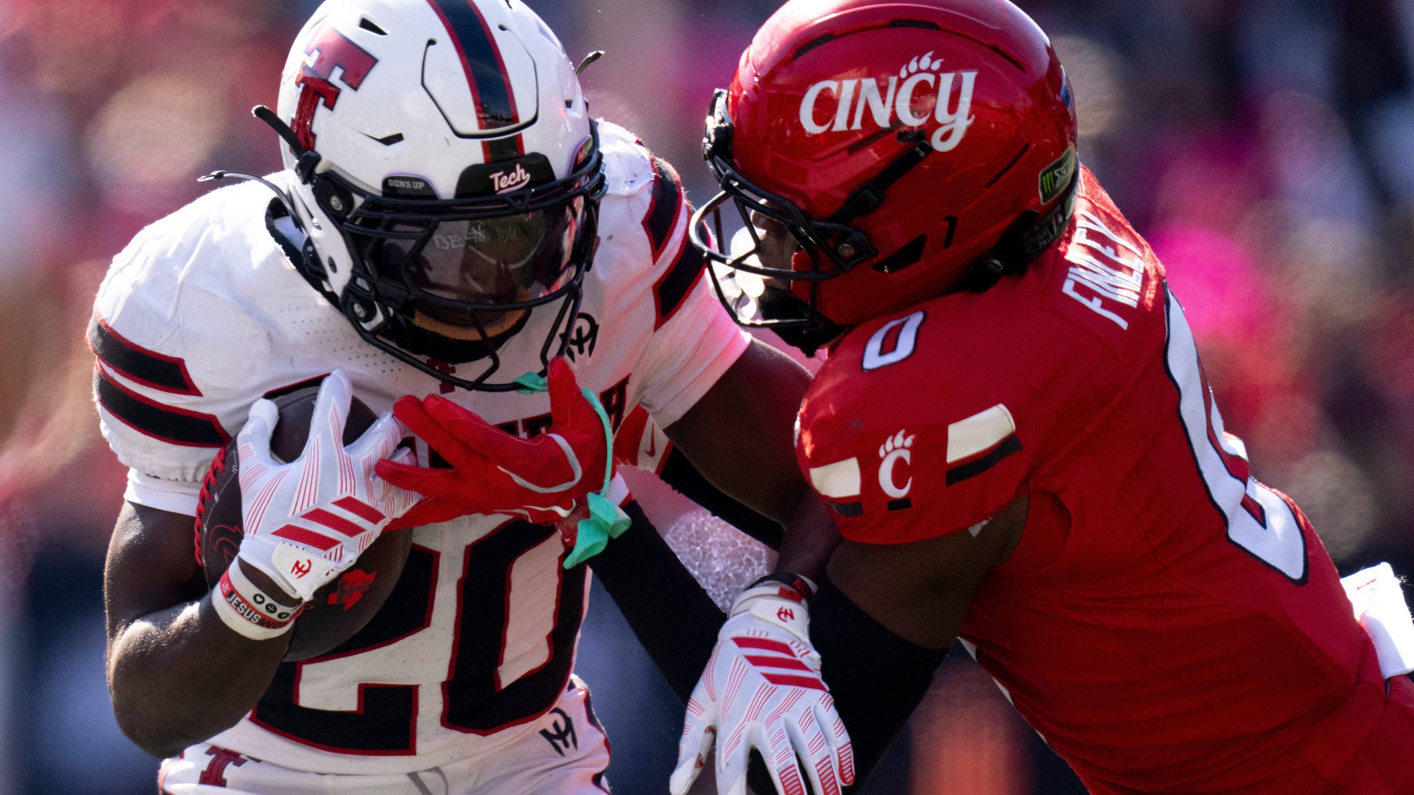 Cincinnati Bearcats cornerback Jacob Finley (0) tackles Texas Tech Red Raiders running back I'Koby Williams (20) in the third quarter of the Big 12 game between Cincinnati Bearcats and Texas Tech at Nippert Stadium in Cincinnati on Saturday, October 24, 2026. | USA TODAY Network via Reuters Connect