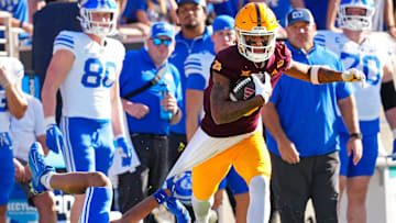 Arizona State wide receiver Jordyn Tyson (0) runs downfield after a catch against BYU safety Raider Damuni (3) during the first half at Mountain America Stadium in Tempe on Nov. 23, 2024.