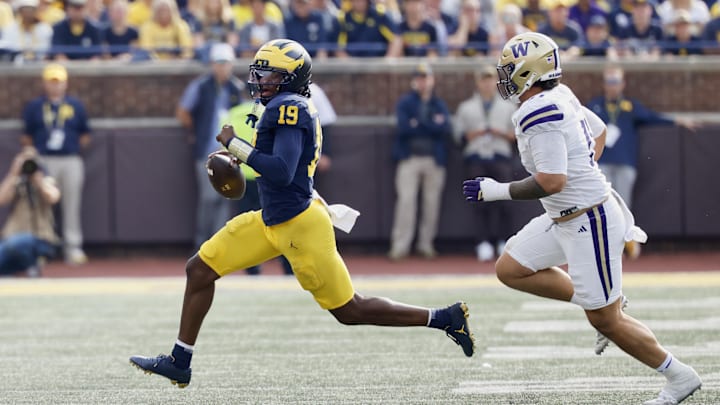 Oct 18, 2025; Ann Arbor, Michigan, USA;  Michigan Wolverines quarterback Bryce Underwood (19) scrambles in the second half against the Washington Huskies at Michigan Stadium. Mandatory Credit: Rick Osentoski-Imagn Images