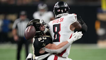 Nov 23, 2025; New Orleans, Louisiana, USA; New Orleans Saints linebacker Pete Werner (20) breaks up the pass to Atlanta Falcons tight end Kyle Pitts Sr. (8) during the first half at Caesars Superdome.