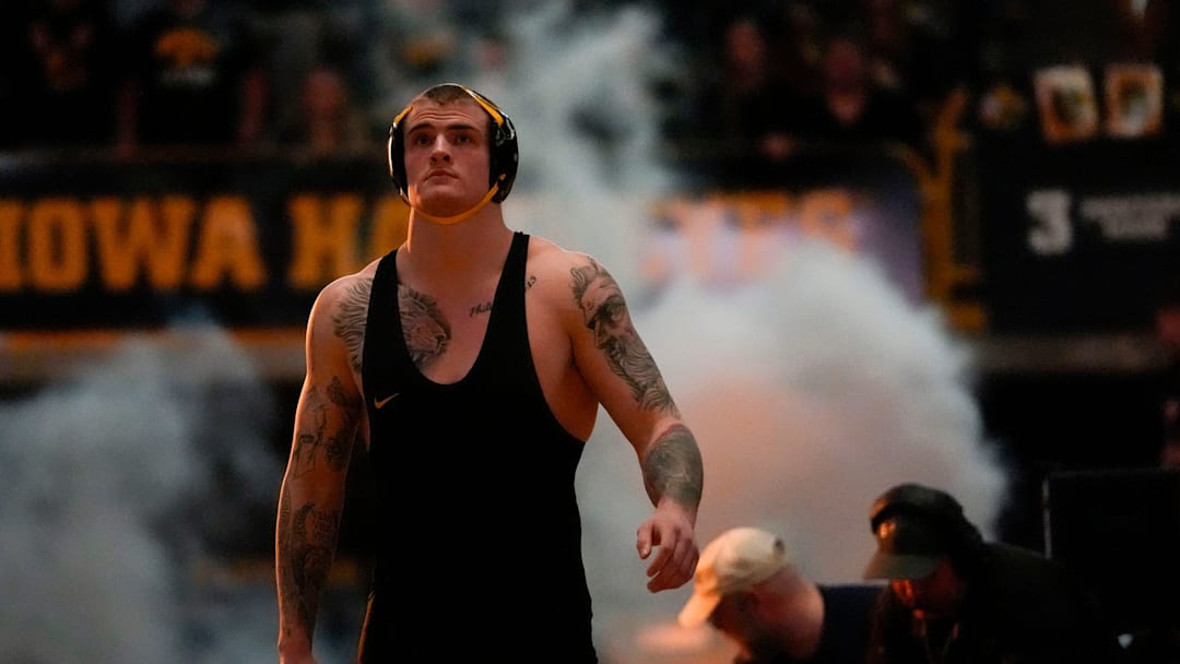 Iowa’s Ben Kueter walks onto the mat before facing Ohio State in a 285-pound match during a Big Ten conference dual Saturday, Jan. 25, 2025, at Carver-Hawkeye Arena in Iowa City, Iowa. Iowa’s Ben Kueter walks onto the mat before facing Ohio State in a 285-pound match during a Big Ten conference dual Saturday, Jan. 25, 2025, at Carver-Hawkeye Arena in Iowa City, Iowa.