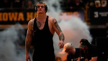 Iowa’s Ben Kueter walks onto the mat before facing Ohio State in a 285-pound match during a Big Ten conference dual Saturday, Jan. 25, 2025 at Carver-Hawkeye Arena in Iowa City, Iowa.