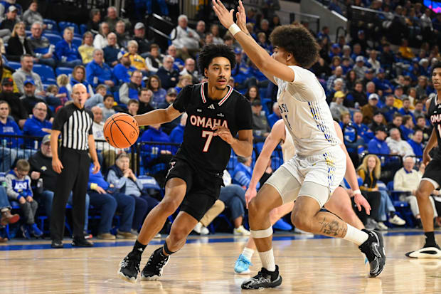 Omaha guard Lance Waddles drives with the basketball during a game last month.