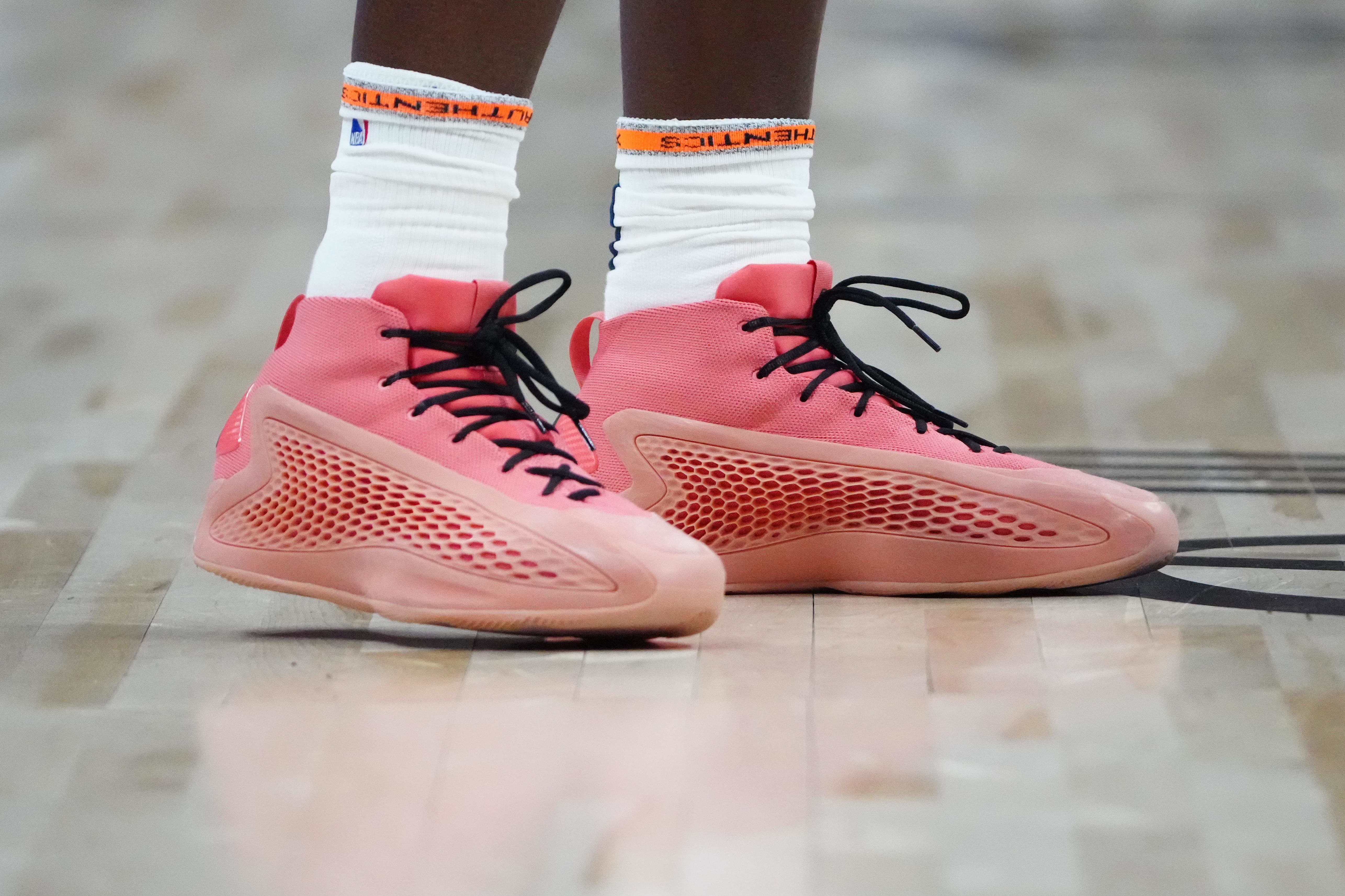 Minnesota Timberwolves guard Anthony Edwards' red adidas sneakers.