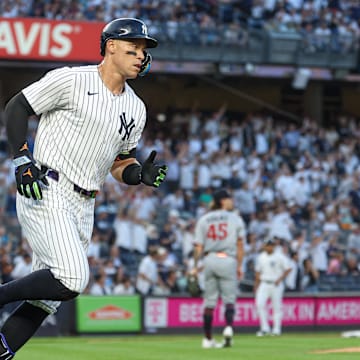 Aug 12, 2025; Bronx, New York, USA; New York Yankees designated hitter Aaron Judge (99) rounds first base after hitting a solo home run during the first inning against Minnesota Twins starting pitcher Travis Adams (45) at Yankee Stadium. Mandatory Credit: Vincent Carchietta-Imagn Images
