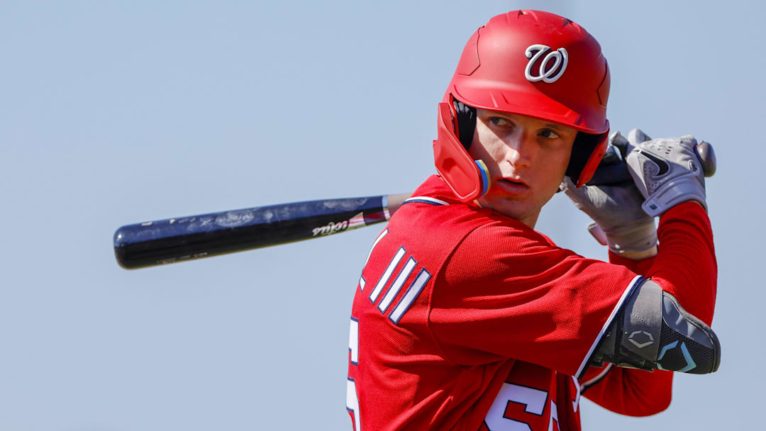 Feb 20, 2023; West Palm Beach, FL, USA; Washington Nationals outfielder Robert Hassell III (55) practices his swing during a spring training workout at The Ballpark of the Palm Beaches