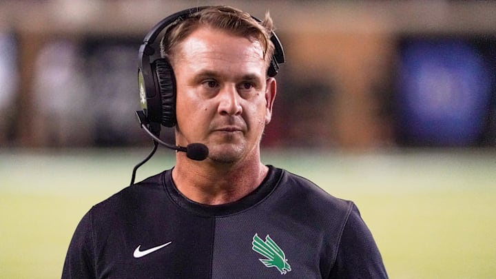 North Texas Mean Green coach Eric Morris stands on the sidelines against the South Florida Bulls during the second half of a game at DATCU Stadium.