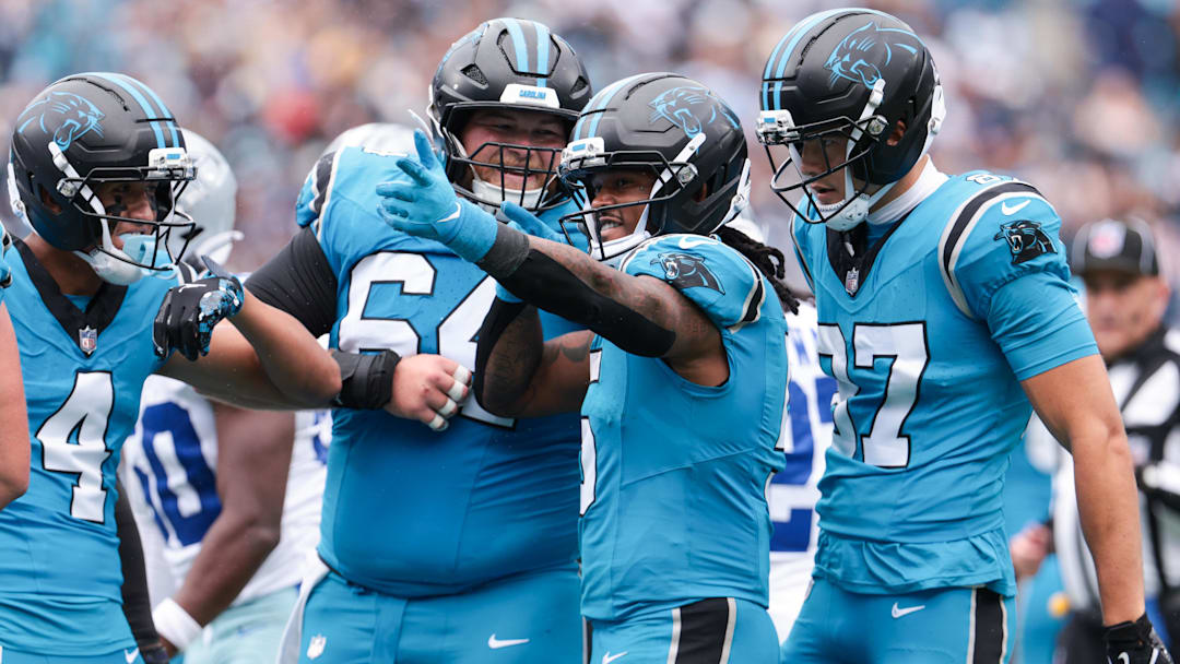 Carolina Panthers running back Rico Dowdle (5) celebrates a first down during the second half against the Dallas Cowboys at Bank of America Stadium. 