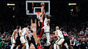 Nov 28, 2023; Boston, Massachusetts, USA; Boston Celtics guard Jaylen Brown (7) and Chicago Bulls center Nikola Vucevic (9) for a jump ball in the second half at TD Garden. Mandatory Credit: David Butler II-Imagn Images