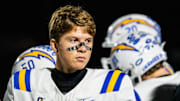 Oxford quarterback Knox Kiffin (13) walks out of a huddle during a high school football game between Murrah and Oxford at Hughes Field in Jackson, Miss., on Thursday, Oct. 30, 2025.