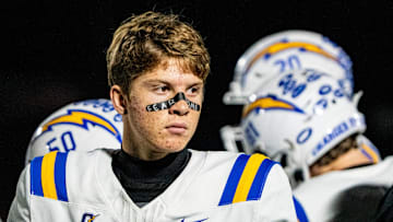 Oxford quarterback Knox Kiffin (13) walks out of a huddle during a high school football game between Murrah and Oxford at Hughes Field in Jackson, Miss., on Thursday, Oct. 30, 2025.