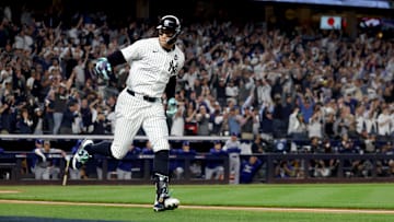 Oct 30, 2024; New York, New York, USA; New York Yankees outfielder Aaron Judge (99) reacts after hitting a two-run home run during the first inning against the Los Angeles Dodgers in game five of the 2024 MLB World Series at Yankee Stadium. Mandatory Credit: Vincent Carchietta-Imagn Images
