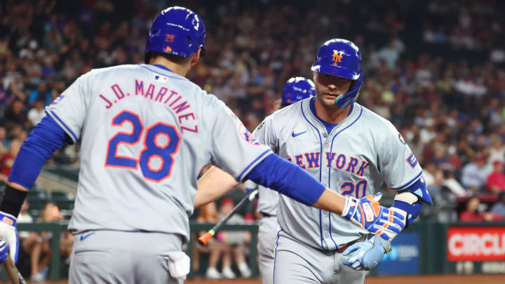 Aug 27, 2024; Phoenix, Arizona, USA; New York Mets first baseman Pete Alonso (right) celebrates with J.D. Martinez after hitting a solo home run in the second inning against the Arizona Diamondbacks at Chase Field.