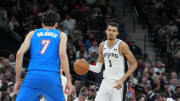 Feb 29, 2024; San Antonio, Texas, USA;  San Antonio Spurs center Victor Wembanyama (1) dribbles in front of Oklahoma City Thunder forward Chet Holmgren (7) in the first half at Frost Bank Center. Mandatory Credit: Daniel Dunn-USA TODAY Sports