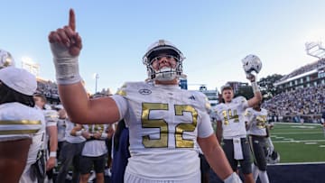 Oct 11, 2025; Atlanta, Georgia, USA; Georgia Tech Yellow Jackets offensive guard Harrison Moore (52) celebrates after a victory over the Virginia Tech Hokies in the fourth quarter at Bobby Dodd Stadium at Hyundai Field. Mandatory Credit: Brett Davis-Imagn Images
