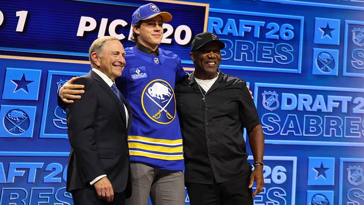 Buffalo Sabres draft pick Ilia Morozov with NHL commissioner Gary Bettman and Buffalo Bills legend Thurman Thomas