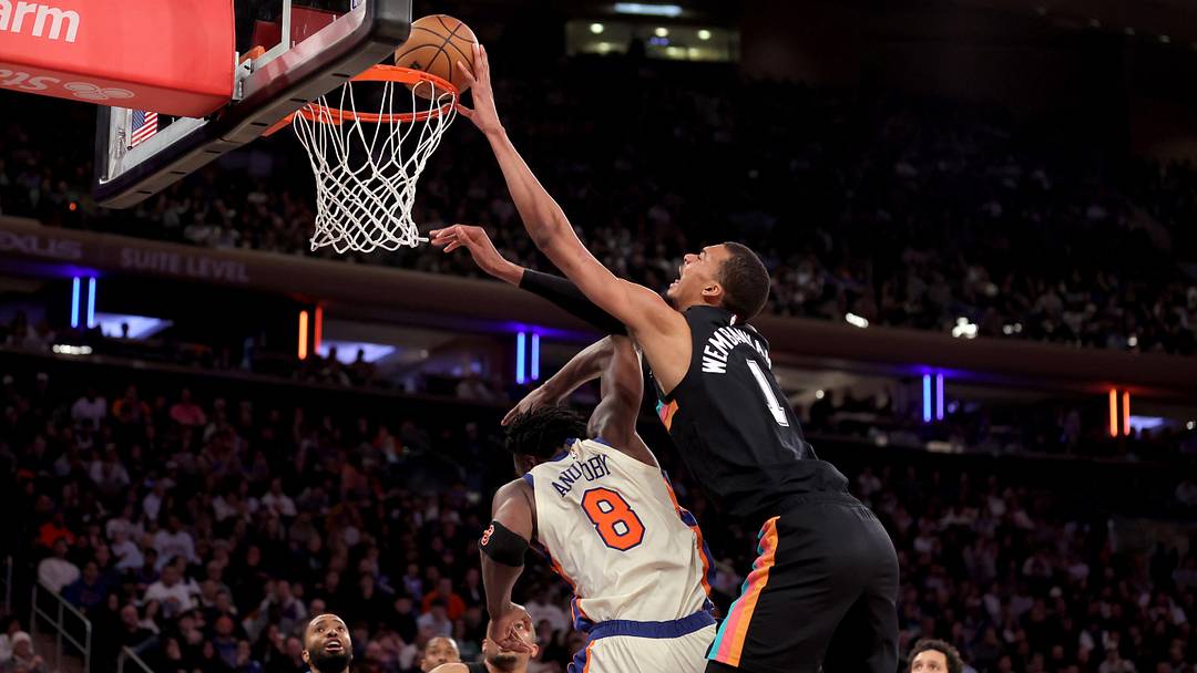 Mar 1, 2026; New York, New York, USA; San Antonio Spurs forward Victor Wembanyama (1) dunks over New York Knicks forward OG Anunoby (8) during the third quarter at Madison Square Garden. Mandatory Credit: Brad Penner-Imagn Images