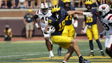 Sep 14, 2024; Ann Arbor, Michigan, USA;  Michigan Wolverines tight end Colston Loveland (18) runs the ball first half against the Arkansas State Red Wolves at Michigan Stadium. Mandatory Credit: Rick Osentoski-Imagn Images
