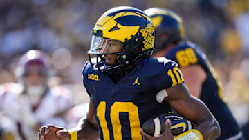Michigan quarterback Alex Orji (10) keeps the ball for a run against USC during the first half at Michigan Stadium in Ann Arbor on Saturday, Sept. 21, 2024.