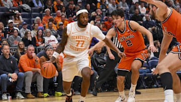Dec 6, 2025; Nashville, Tennessee, USA;  Tennessee Volunteers guard Amaree Abram (77) drives baseline against the Illinois Fighting Illini during the first half at Bridgestone Arena. Mandatory Credit: Steve Roberts-Imagn Images