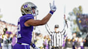 Washington Huskies wide receiver Denzel Boston celebrates after catching a touchdown pass against the Michigan Wolverines.