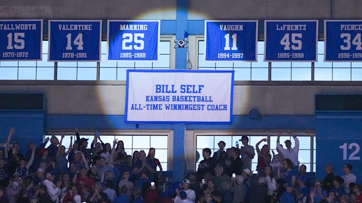 Nov 16, 2024; Lawrence, Kansas, USA; A new banner showing Kansas Jayhawks head coach Bill Self’s accomplishment is displayed prior to a game against the Oakland Golden Grizzlies at Allen Fieldhouse. Mandatory Credit: Denny Medley-Imagn Images Nov 16, 2024; Lawrence, Kansas, USA; A new banner showing Kansas Jayhawks head coach Bill Self’s accomplishment is displayed prior to a game against the Oakland Golden Grizzlies at Allen Fieldhouse. Mandatory Credit: Denny Medley-Imagn Images