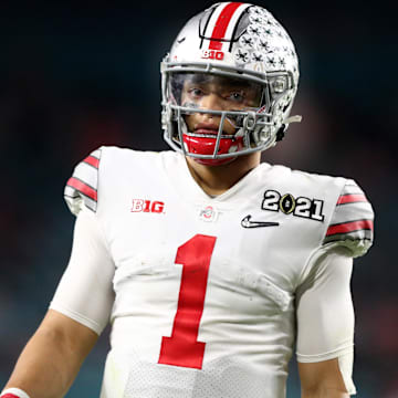 Jan 11, 2021; Miami Gardens, Florida, USA; Ohio State Buckeyes quarterback Justin Fields (1) against the Alabama Crimson Tide in the 2021 CFP National Championship Game. Mandatory Credit: Mark J. Rebilas-Imagn Images