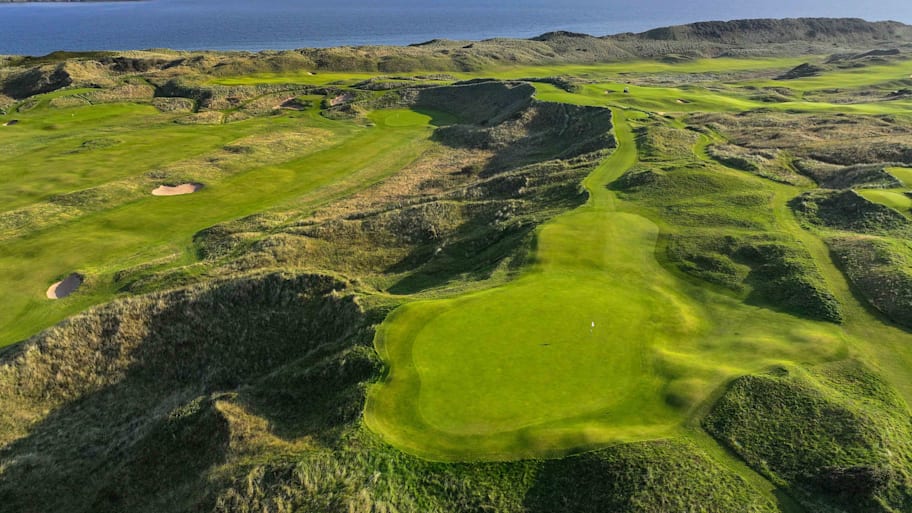 An aerial view of the 206-yard par-3 16th hole "Calamity Corner" at Royal Portrush Golf Club.  | David Cannon/R&A via Getty Images