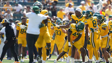 The Baylor Bears celebrate after blocking a field goal attempt against the Kansas State Wildcats at the end of the second half at McLane Stadium