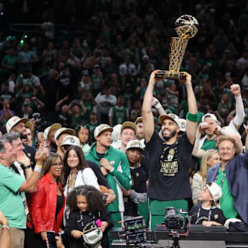 Jun 17, 2024; Boston, Massachusetts, USA; Boston Celtics forward Jayson Tatum (0) lifts the trophy after winning the 2024 NBA Finals against the Dallas Mavericks at TD Garden. Mandatory Credit: Peter Casey-Imagn Images