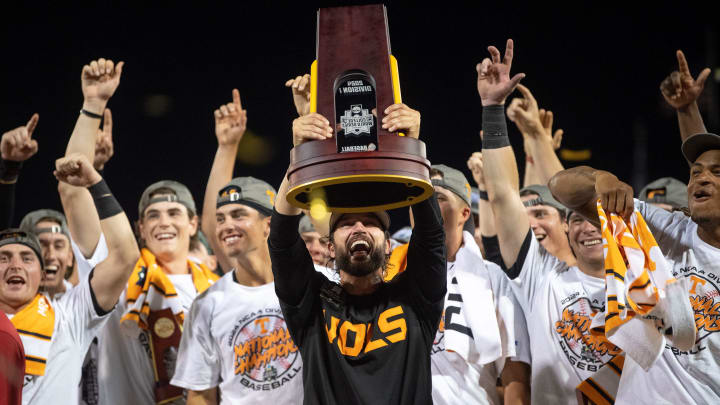 Tennessee head coach Tony Vitello holds up the trophy after game three of the NCAA College World Series finals between Tennessee and Texas A&M