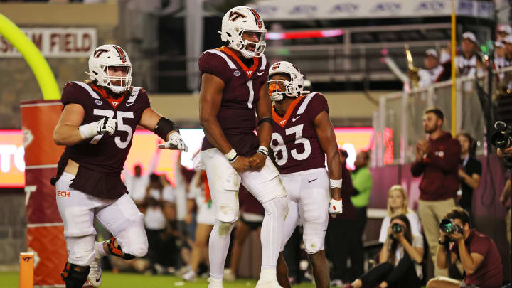 Sep 30, 2023; Blacksburg, Virginia, USA; Virginia Tech Hokies quarterback Kyron Drones (1) celebrates after scoring a touchdown during the third quarter against the Pittsburgh Panthers at Lane Stadium. Mandatory Credit: Peter Casey-USA TODAY Sports