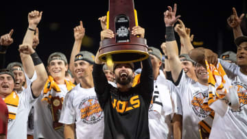 Tennessee head coach Tony Vitello holds up the trophy after game three of the NCAA College World Series finals between Tennessee and Texas A&M at Charles Schwab Field in Omaha, Neb., on Monday, June 24, 2024.