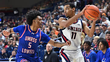 Nov 15, 2024; Spokane, Washington, USA; Gonzaga Bulldogs guard Nolan Hickman (11) controls the ball against UMass Lowell River Hawks guard Martin Somerville (5) in the first half at McCarthey Athletic Center. Mandatory Credit: James Snook-Imagn Images
