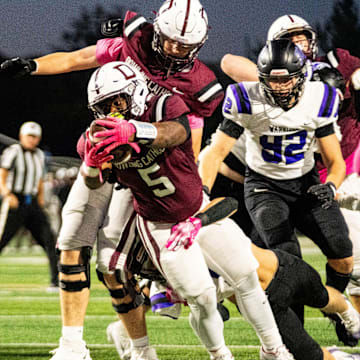 Dowling Catholic’s Ian Middleton (5) reaches across the goal line for a touchdown on Oct. 10, 2025, at Valley Stadium in West Des Moines.