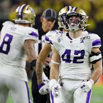 UW linebacker Carson Bruener (42) reacts to a CFP championship game play in January. 