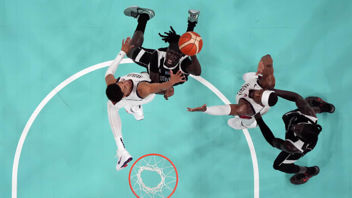 Jul 31, 2024; Villeneuve-d'Ascq, France; United States guard Tyrese Haliburton (9) and center Bam Adebayo (13) fight for position with South Sudan small forward Nuni Omot (5) and power forward Wenyen Gabriel (9) in the second quarter during the Paris 2024 Olympic Summer Games at Stade Pierre-Mauroy. Mandatory Credit: John David Mercer-USA TODAY Sports