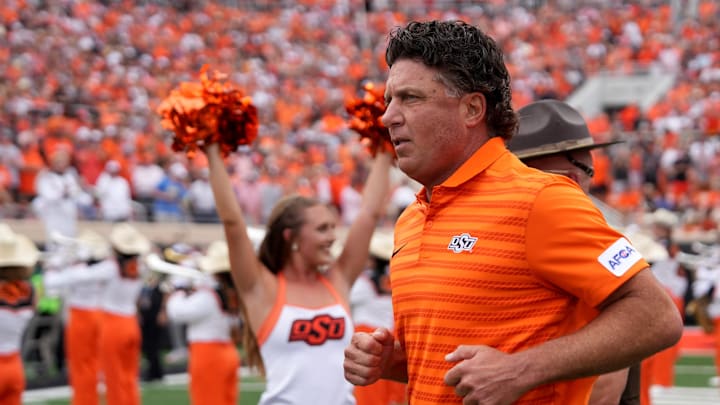 Oklahoma State head football coach Mike Gundy runs on to the field in the first half of the college football game between the Oklahoma State Cowboys and South Dakota State Jackrabbits at Boone Pickens Stadium in Stillwater, Okla., Saturday, Aug., 31, 2024.