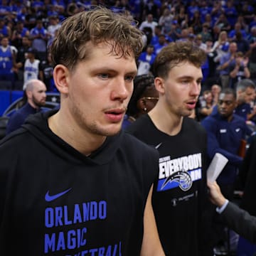 Orlando Magic forward Franz Wagner (22) and center Moritz Wagner (21) celebrate after beating the Cleveland Cavaliers during game four of the first round for the 2024 NBA playoffs at Kia Center.