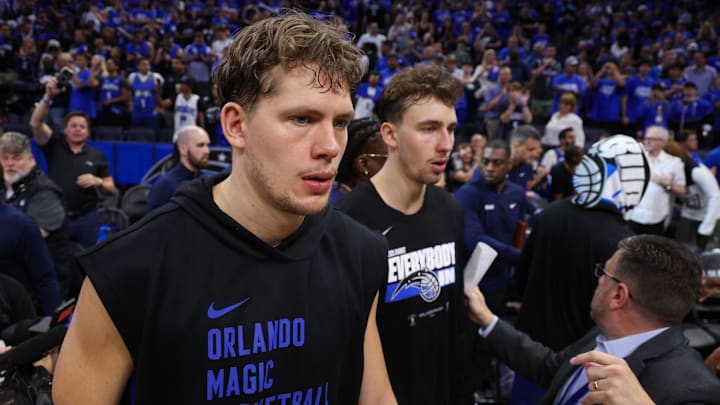 Orlando Magic forward Franz Wagner (22) and center Moritz Wagner (21) celebrate after beating the Cleveland Cavaliers during game four of the first round for the 2024 NBA playoffs at Kia Center.